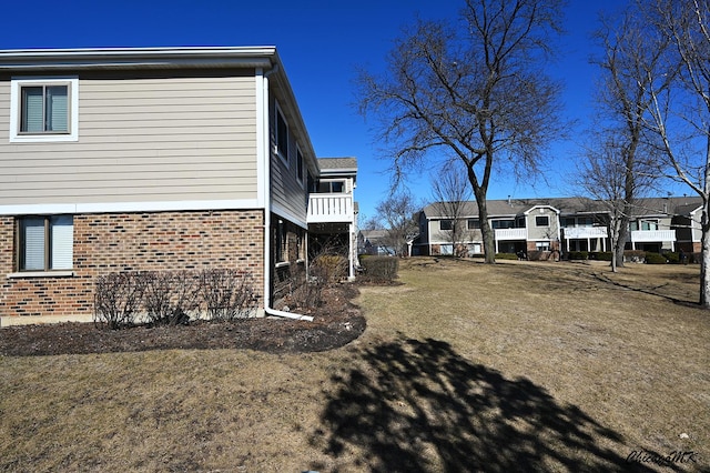 view of side of property with brick siding