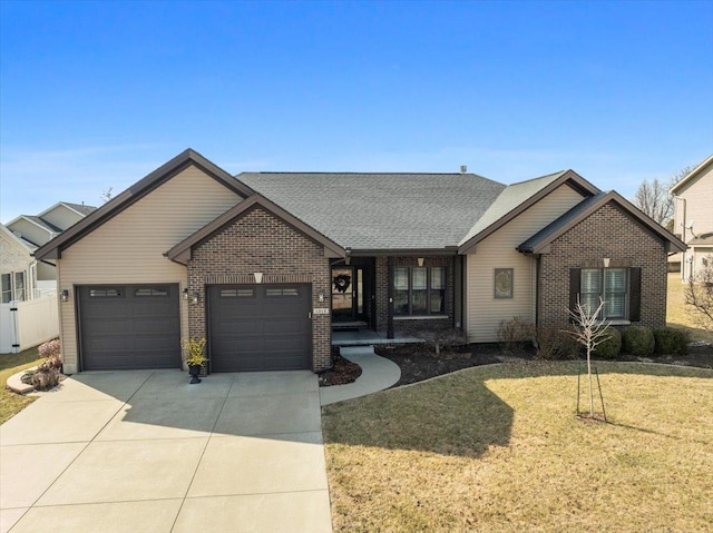 view of front facade featuring a front lawn, concrete driveway, an attached garage, a shingled roof, and brick siding