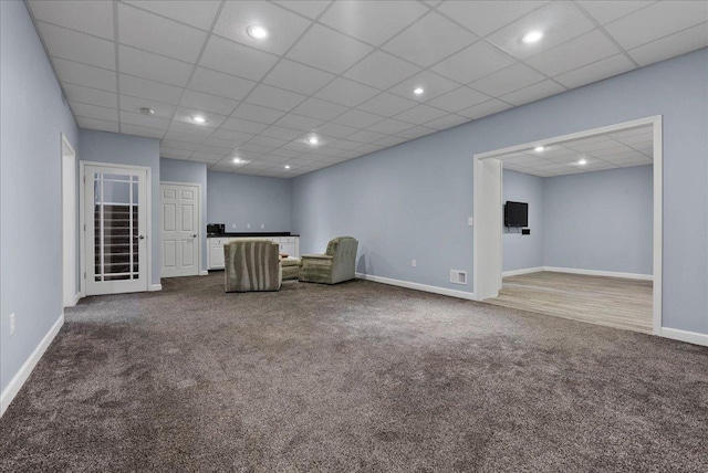 unfurnished room featuring visible vents, baseboards, a drop ceiling, dark carpet, and recessed lighting