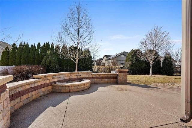 view of patio / terrace featuring fence and an outdoor fire pit