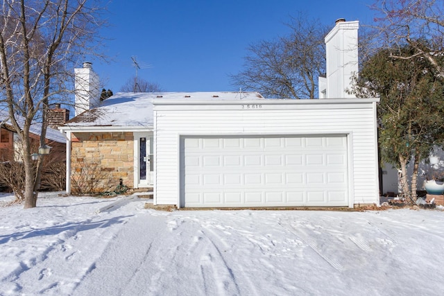 view of snow covered garage