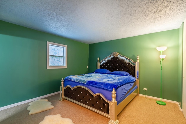 carpeted bedroom with a textured ceiling and baseboards