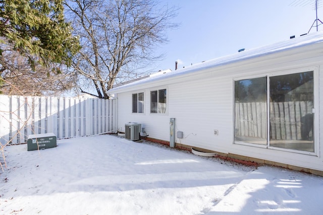 exterior space featuring fence and central AC unit