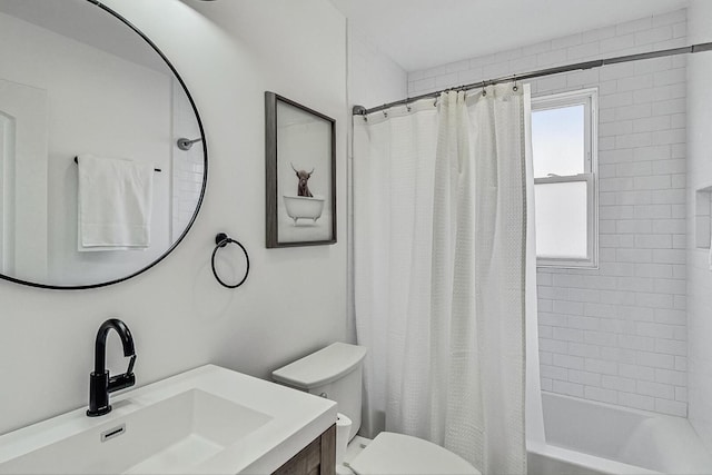 bathroom with vanity, toilet, and shower / tub combo