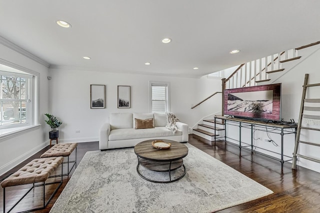 living area with a wealth of natural light, stairway, baseboards, and dark wood-style floors