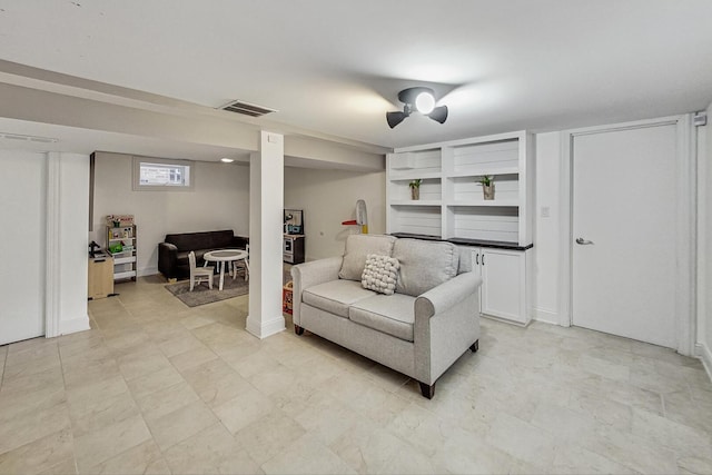 living room with visible vents and baseboards