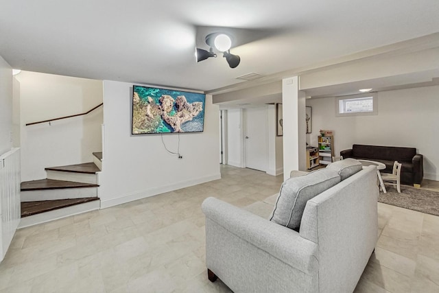 living room featuring stairway, visible vents, and baseboards