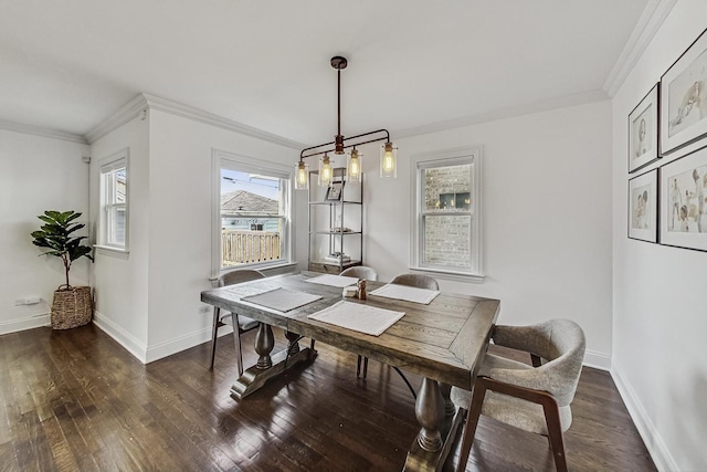 dining space featuring baseboards, dark wood finished floors, and ornamental molding