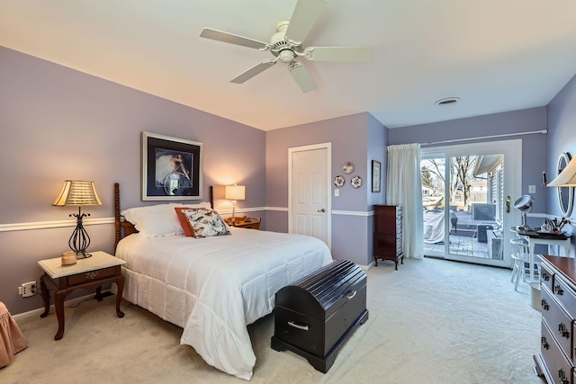 bedroom with access to exterior, ceiling fan, visible vents, and light colored carpet