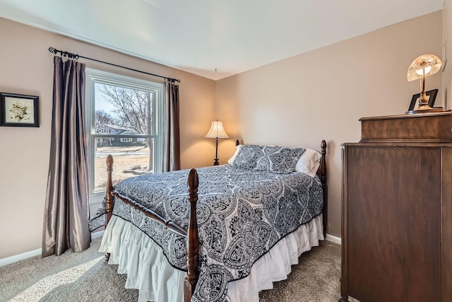 carpeted bedroom featuring baseboards