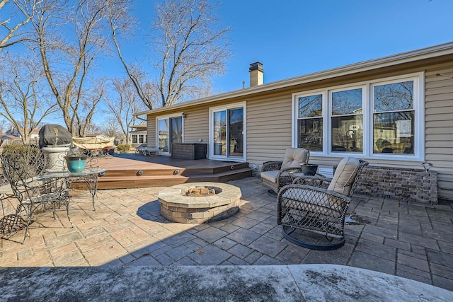 view of patio / terrace featuring a fire pit and a wooden deck