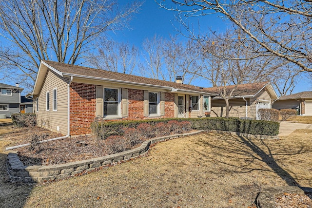 single story home featuring an attached garage, a chimney, concrete driveway, and brick siding