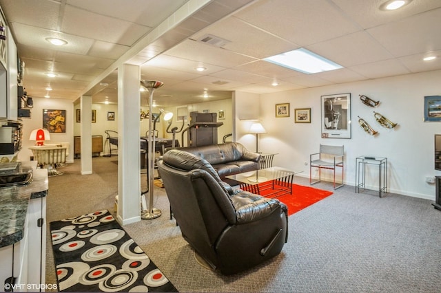 carpeted living room featuring recessed lighting, baseboards, visible vents, and a drop ceiling