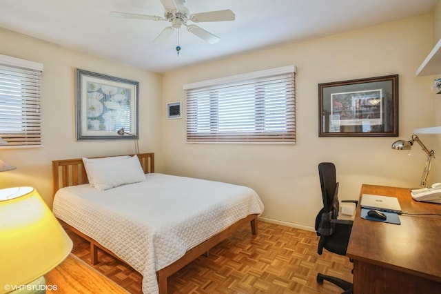 bedroom featuring baseboards and ceiling fan