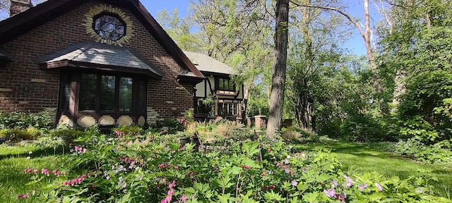 27W161 Mack Rd, Wheaton, IL 60189 - view of property exterior featuring brick siding and a chimney