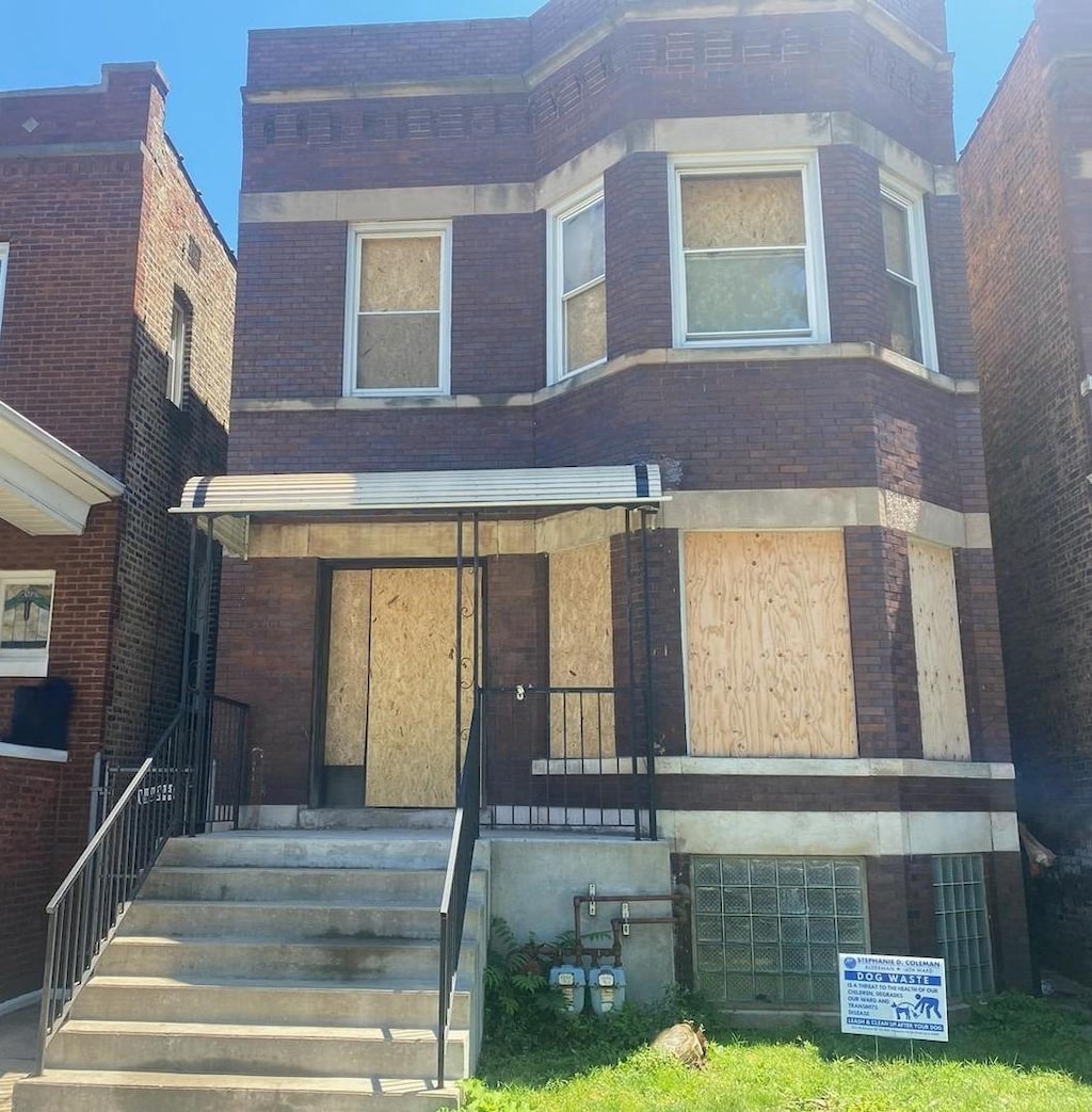 view of property with brick siding