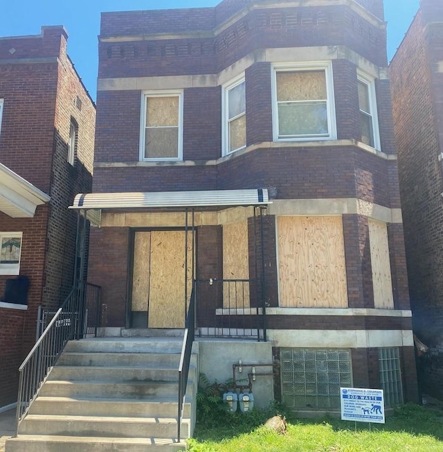 view of property with brick siding