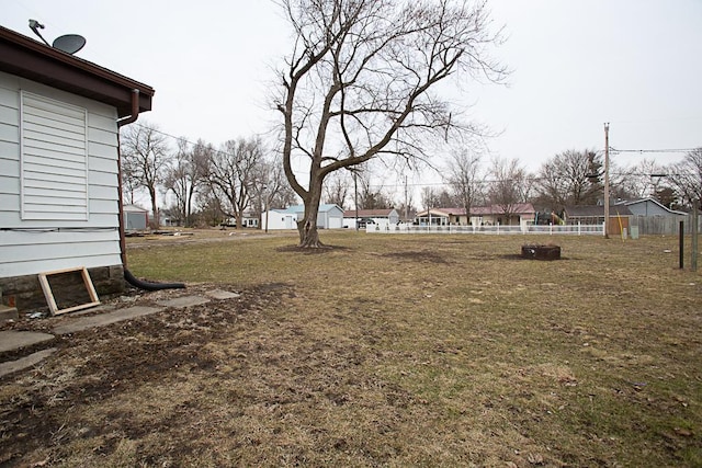 view of yard featuring a residential view and fence