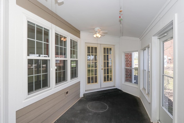 unfurnished sunroom featuring french doors