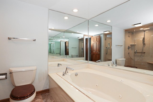 bathroom with toilet, a stall shower, baseboards, and a whirlpool tub