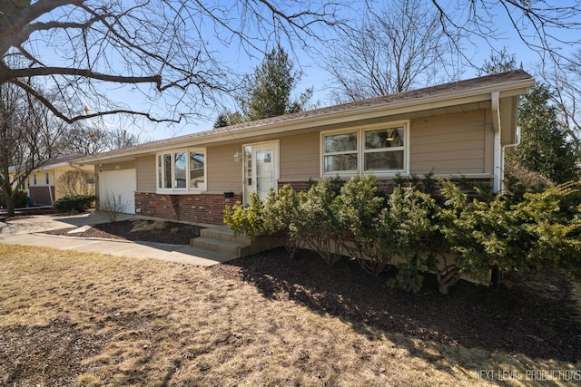 ranch-style home with brick siding and an attached garage