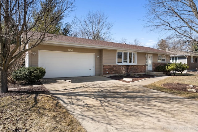 ranch-style house with an attached garage, brick siding, and driveway