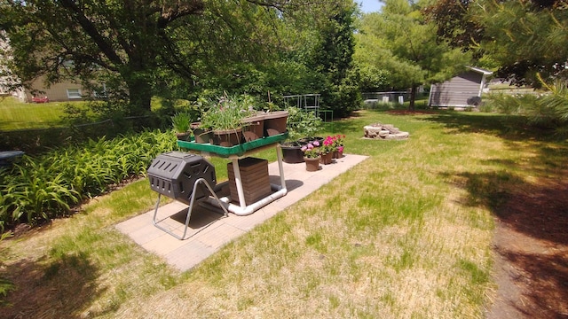 view of yard with a vegetable garden and fence