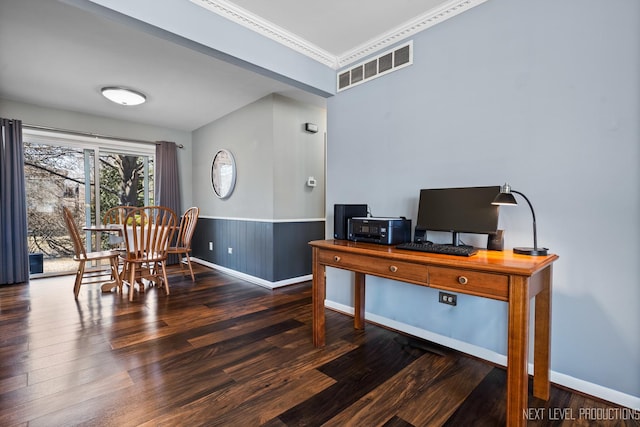 home office with visible vents, wood finished floors, a wainscoted wall, and ornamental molding