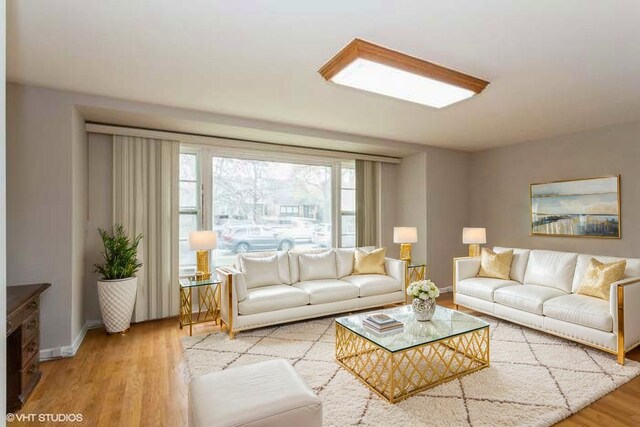 6118 N Kimball Ave, Chicago, IL 60659 - living area with baseboards and wood finished floors