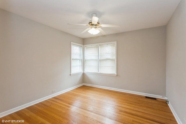 6118 N Kimball Ave, Chicago, IL 60659 - empty room with light wood-style floors, a ceiling fan, baseboards, and visible vents