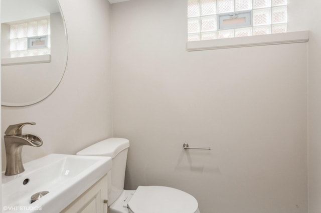 6118 N Kimball Ave, Chicago, IL 60659 - half bathroom featuring vanity and toilet