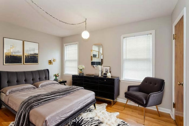 6118 N Kimball Ave, Chicago, IL 60659 - bedroom featuring baseboards and light wood-style flooring