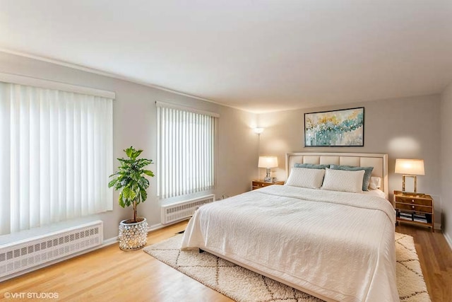 6118 N Kimball Ave, Chicago, IL 60659 - bedroom featuring radiator and wood finished floors