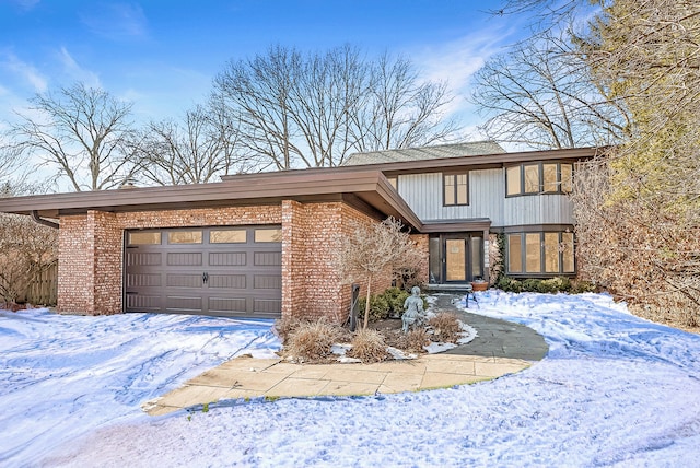 view of front of house featuring brick siding and an attached garage