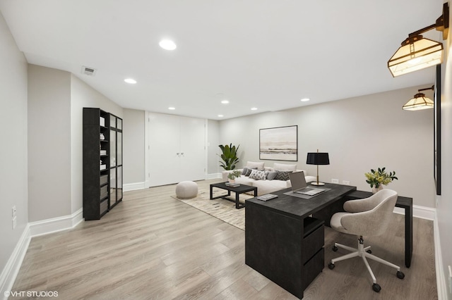 office area featuring light wood-style flooring, baseboards, and recessed lighting