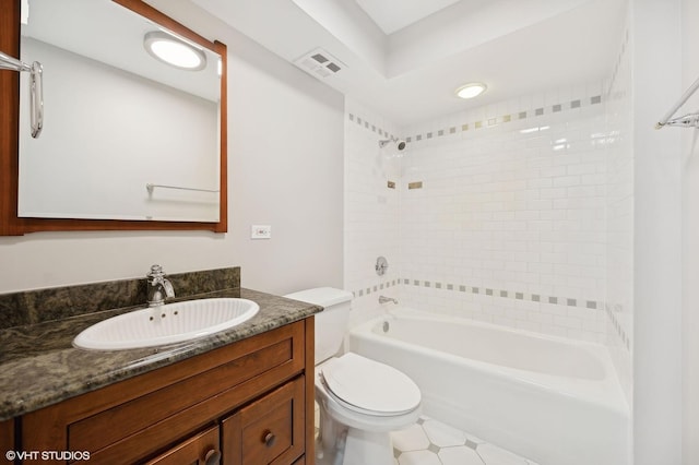 full bathroom with visible vents, bathing tub / shower combination, toilet, and vanity