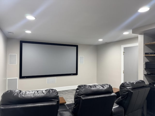 home theater featuring baseboards, visible vents, and recessed lighting