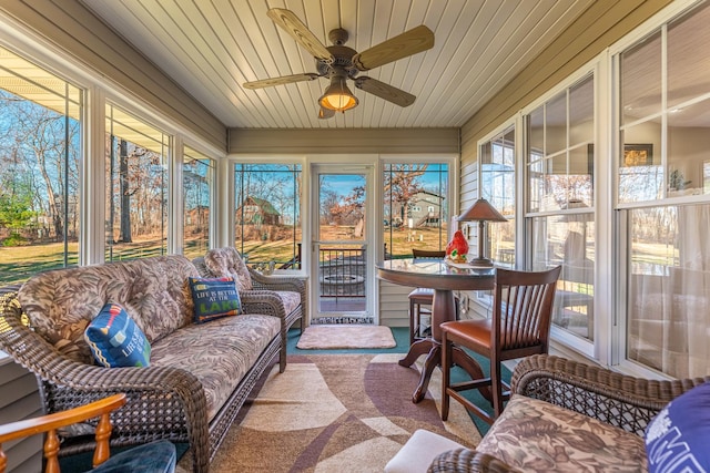 sunroom with a ceiling fan