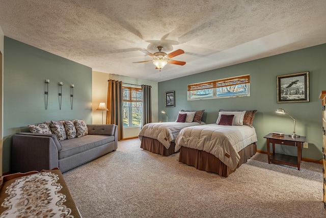 carpeted bedroom with baseboards, a ceiling fan, and a textured ceiling