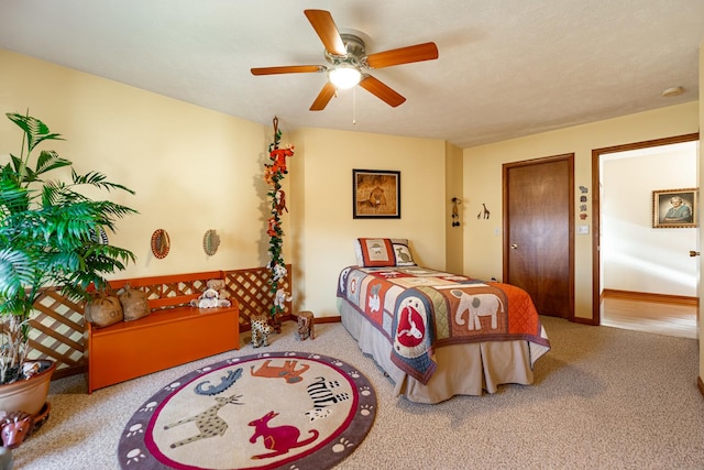 bedroom with ceiling fan and baseboards