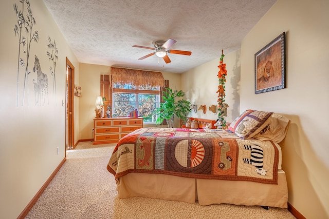 bedroom featuring carpet, ceiling fan, a textured ceiling, and baseboards