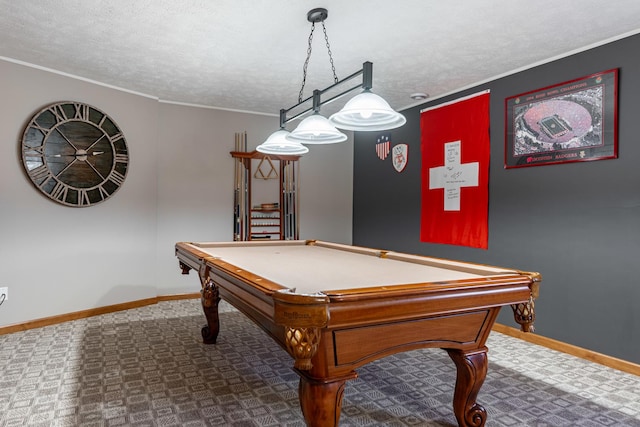 recreation room with crown molding, a textured ceiling, and baseboards