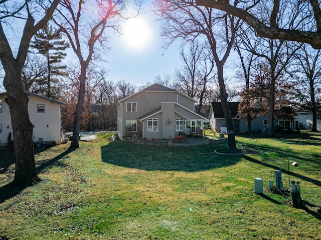 view of side of home featuring a yard