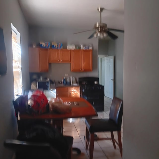 kitchen with light tile patterned flooring and a ceiling fan