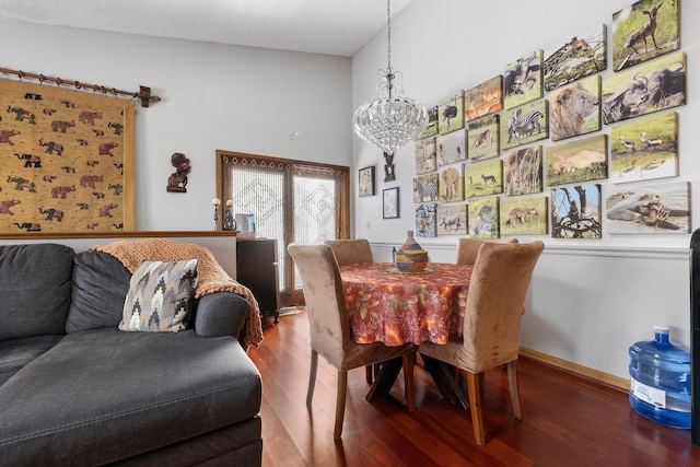 dining room with a notable chandelier and wood finished floors