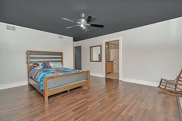 bedroom featuring visible vents, ceiling fan, baseboards, and wood finished floors