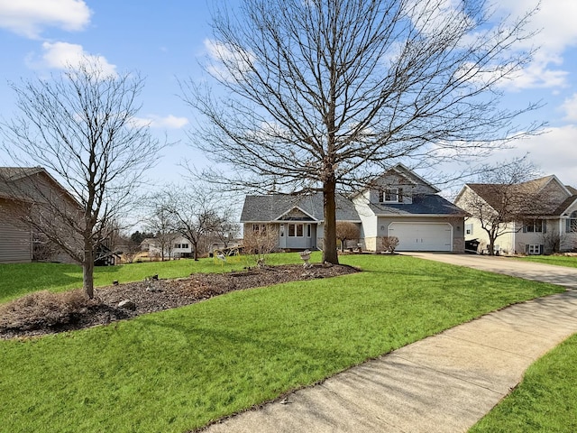 view of front of house with an attached garage, concrete driveway, and a front yard