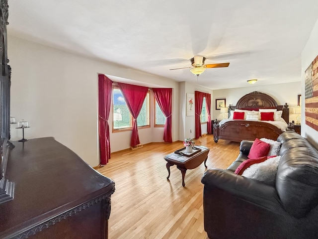 bedroom featuring a ceiling fan and light wood-type flooring