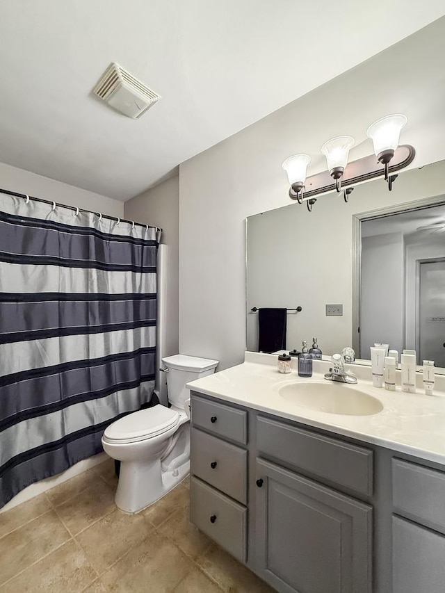 full bathroom featuring visible vents, toilet, vanity, a shower with curtain, and tile patterned floors