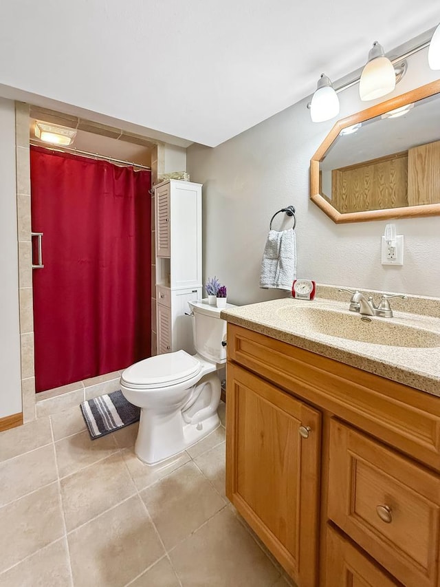 full bathroom featuring curtained shower, vanity, toilet, and tile patterned floors